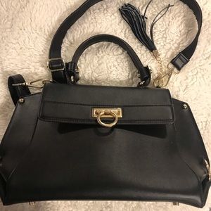 Black handbag with shoulder straps